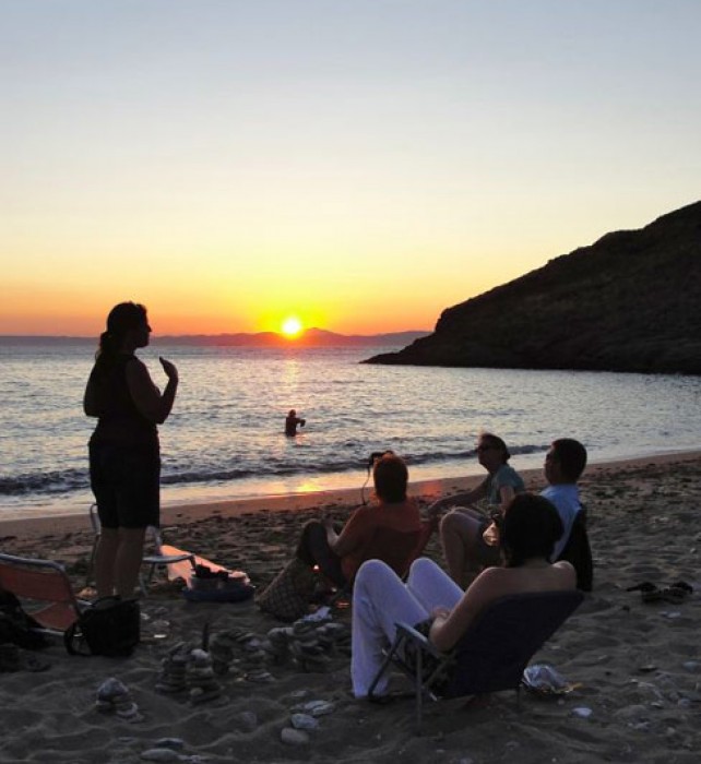 Sunset picnic on the beach, watching the sun set behind the mainland mountains.