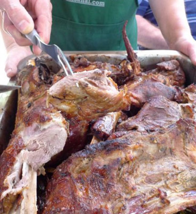 Local, free-range kid roasted in our wood fired oven over a bed of lentiscus and rosemary sprigs.